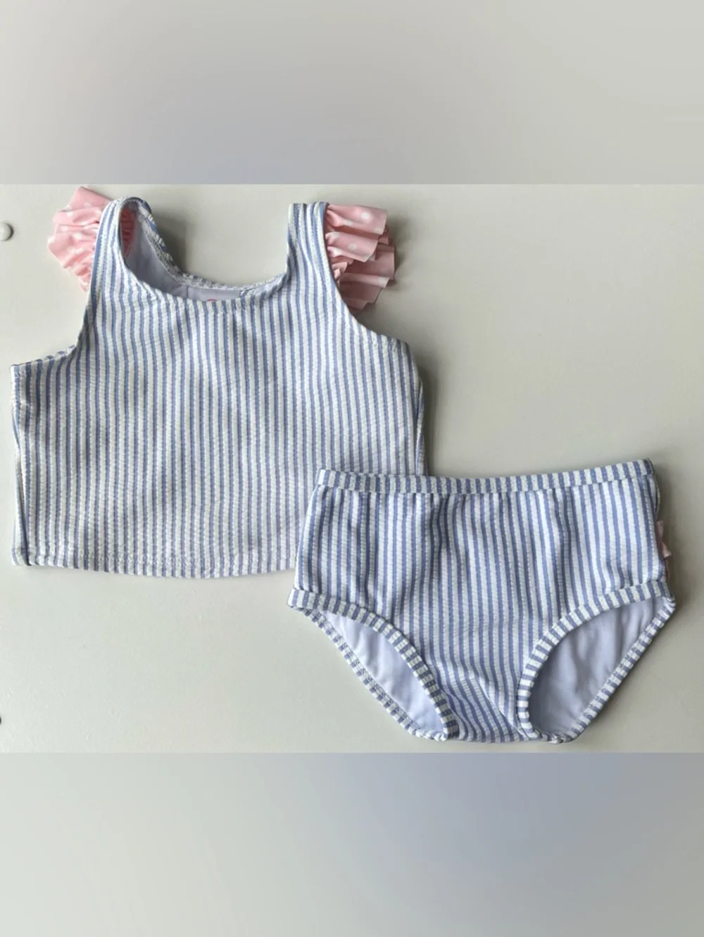 RuffleButts Blue Seersucker Two-Piece Swimsuit with Pink Polka Dot Ruffles